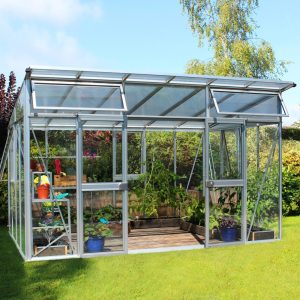 Aluminum and glass greenhouse by A1 Greenhouses showcasing durable, eco-friendly, and customizable optima greenhouse designs for gardening enthusiasts.