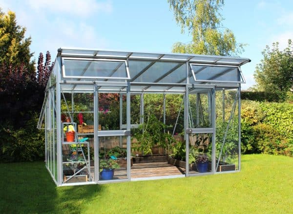 Aluminum and glass greenhouse by A1 Greenhouses showcasing durable, eco-friendly, and customizable optima greenhouse designs for gardening enthusiasts.