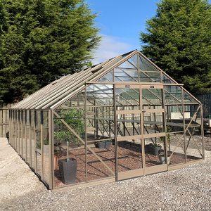 A1 Greenhouses outdoor glass greenhouse with sturdy metal frame, ideal for gardening, plant cultivation, and temperature control, perfect for home or commercial use.