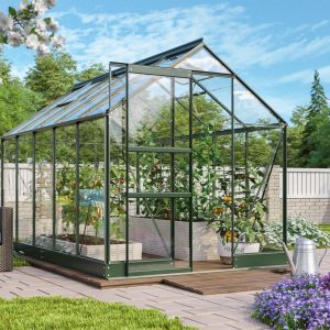 Lush greenhouse with vibrant vegetables and flowers surrounded by a well-maintained garden and outdoor seating area, perfect for gardening enthusiasts seeking high-quality greenhouses.