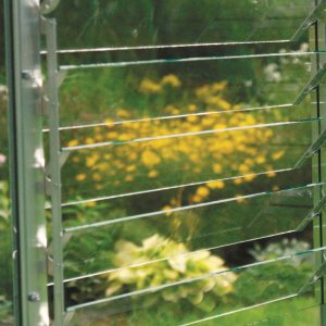 A1 Greenhouses aluminum louvered window system for optimal climate control and plant growth.