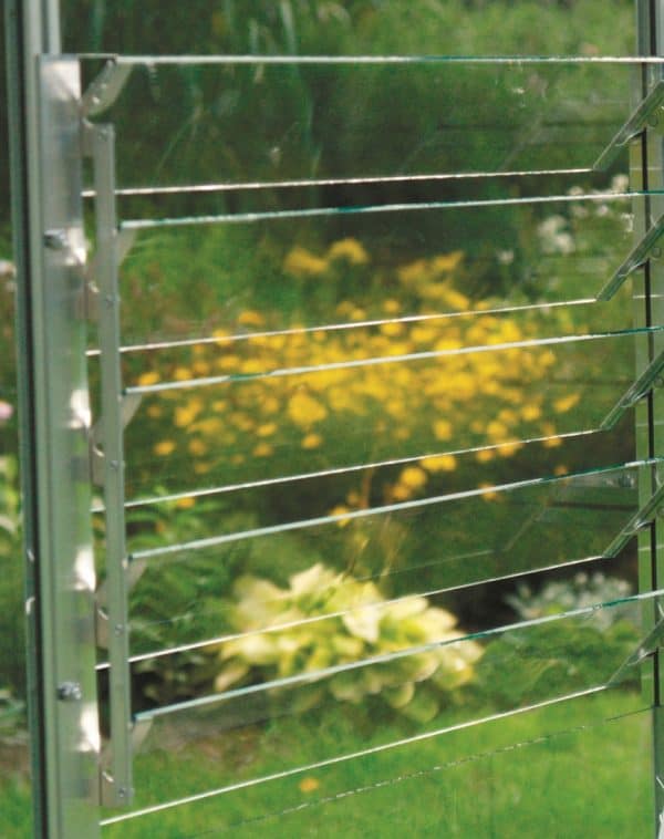 A1 Greenhouses aluminum louvered window system for optimal climate control and plant growth.