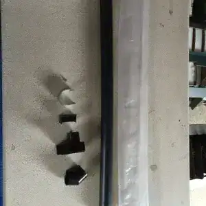 Heavy-duty green greenhouse frame support pole with adjustable black brackets and assembly components for optimal plant environment control.