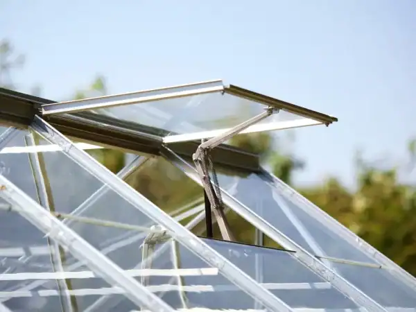 Highly durable glass greenhouse roofing system with adjustable ventilation for optimal plant growth. Perfect for commercial and home gardening enthusiasts.