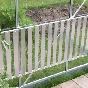 Aluminum greenhouse door with secure latch for optimal plant growth and protection.