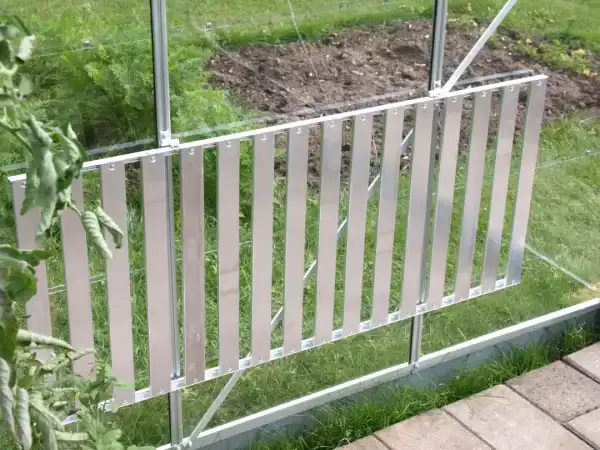 Aluminum greenhouse door with secure latch for optimal plant growth and protection.