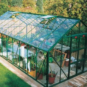 Extended glass greenhouse ideal for home gardening and plant cultivation, manufactured by A1 Greenhouses offering high-quality outdoor garden structures.