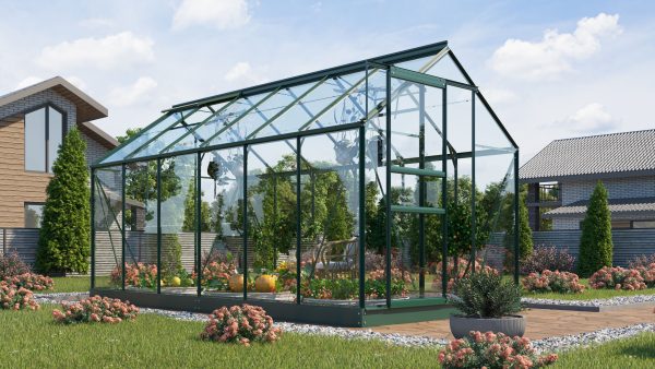 Large glass greenhouse with lush interior planting, situated in a modern residential garden, ideal for home gardening and plant cultivation.